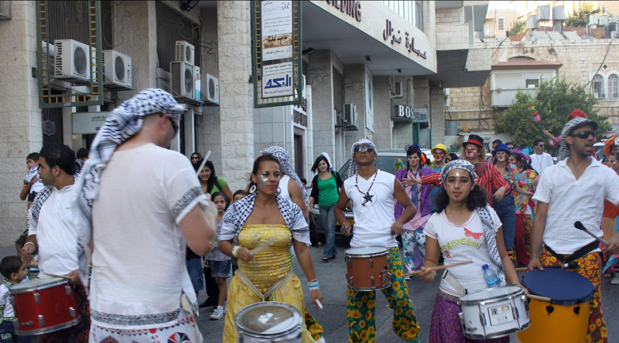 Katumba Founders Juliana and Ritchie in Palestine, where they worked with young refugees putting together their first street carnival.